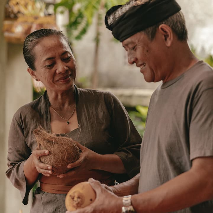 Balinese Airbnb hosts who is also a couple engaging with each other