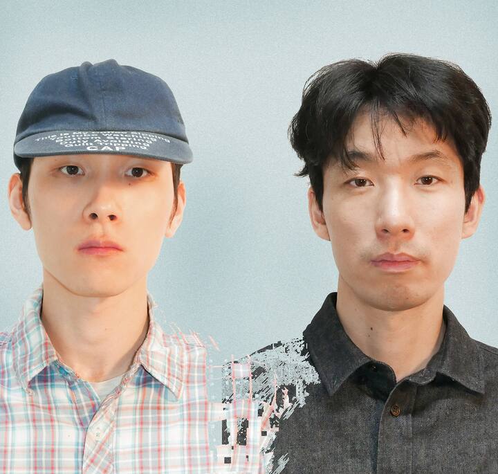 Two individuals are side by side, one wearing a blue cap and plaid shirt, and the other wearing a dark gray button-up shirt against a light blue background.