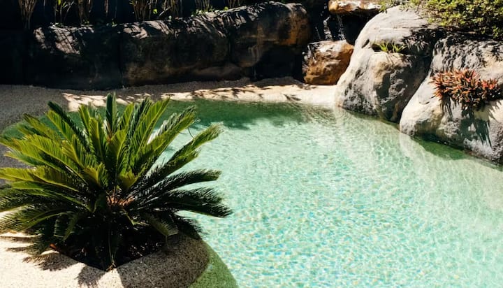 Rock-lined pool with clear water