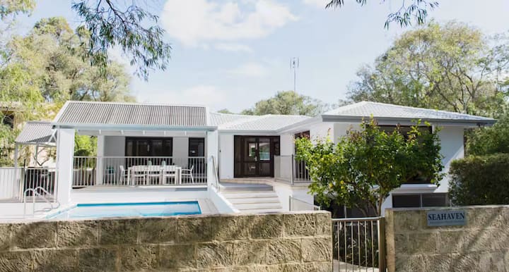 White house with pool and patio