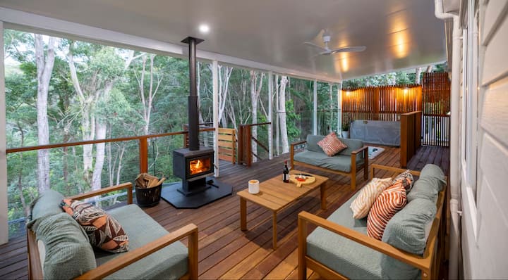 Covered deck with fireplace and seating