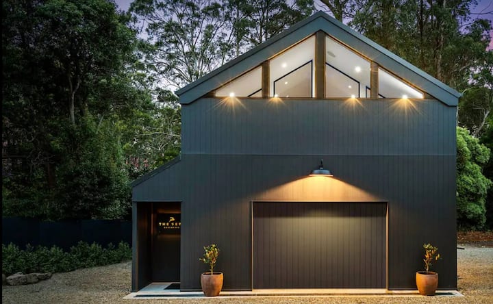 Modern dark grey barn-style house