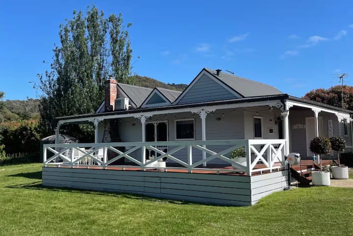 Grey country house with large veranda