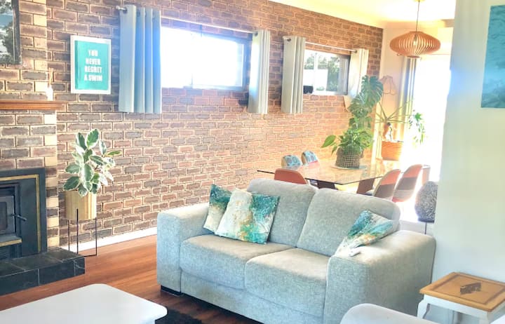 Living room with brick wall and sofa