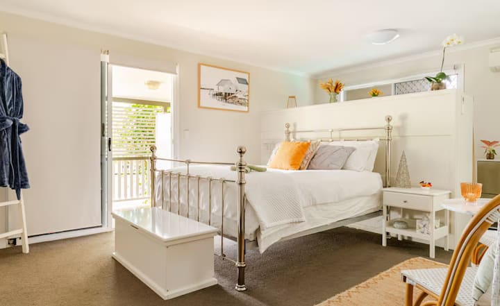 Bright bedroom with metal bed frame