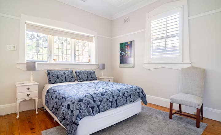 Bedroom with patterned blue bedding