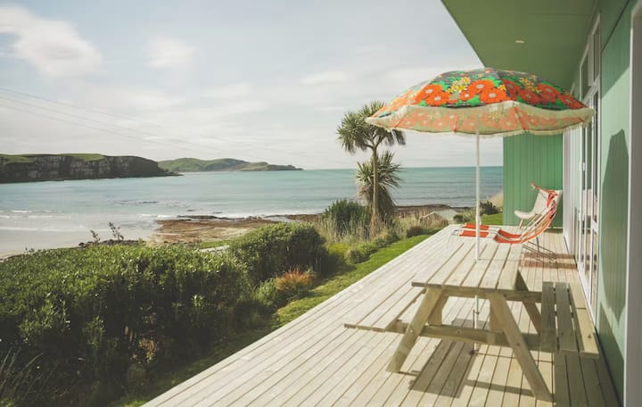 Seaside deck with retro umbrella and ocean view