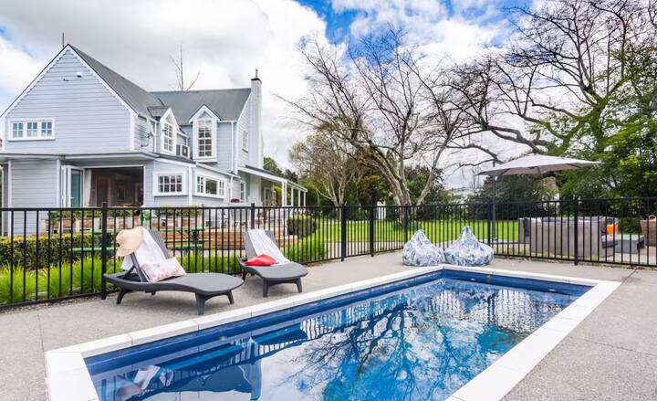 Elegant blue villa with private pool and garden loungers