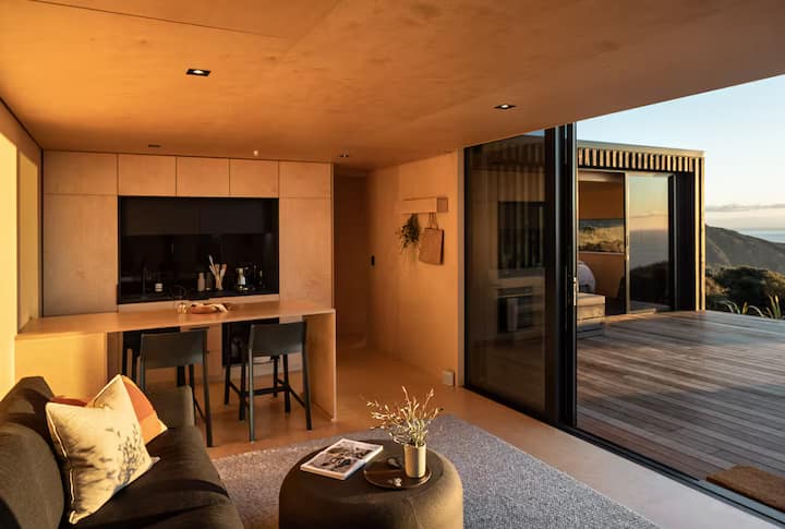 Warm modern living space with ocean view balcony