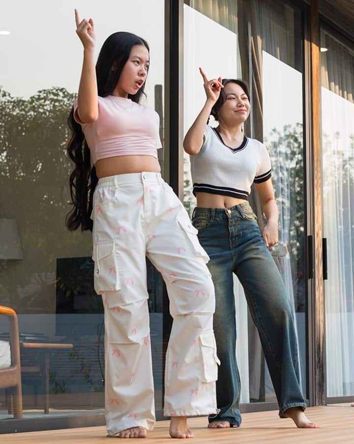 Girls dancing to KPop in front of an Airbnb