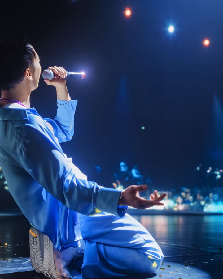 Man singing on stage