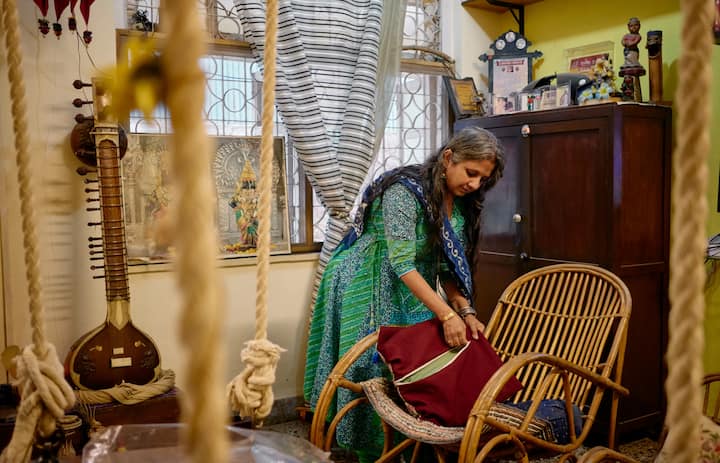 Indian woman host Airbnb cleaning the house