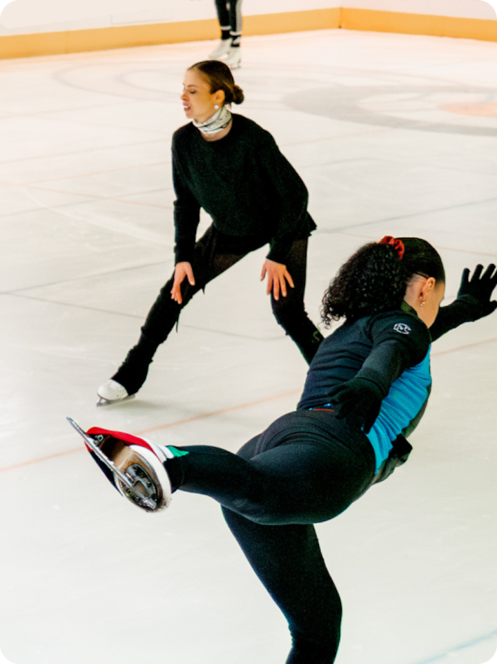 Italian figure skater Carolina Kostner and a female skater on the ice in a training session