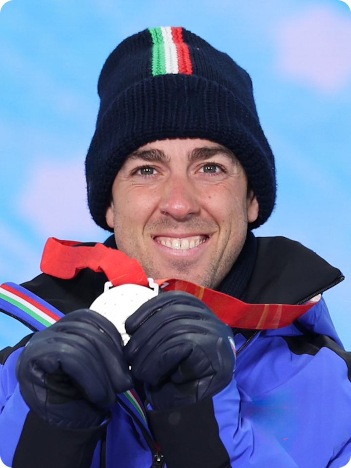 Close shot of Federico Pellegrino smiling and displaying his silver medal