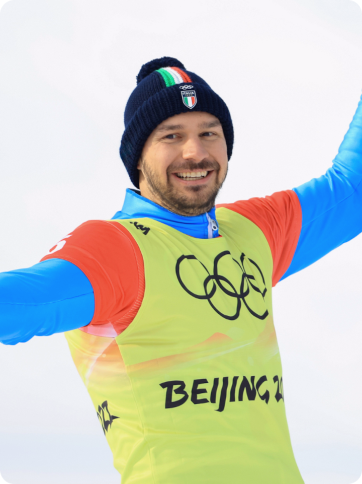 Italian Olympian Omar Visintin smiling on the slope post race at the Beijing Olympics