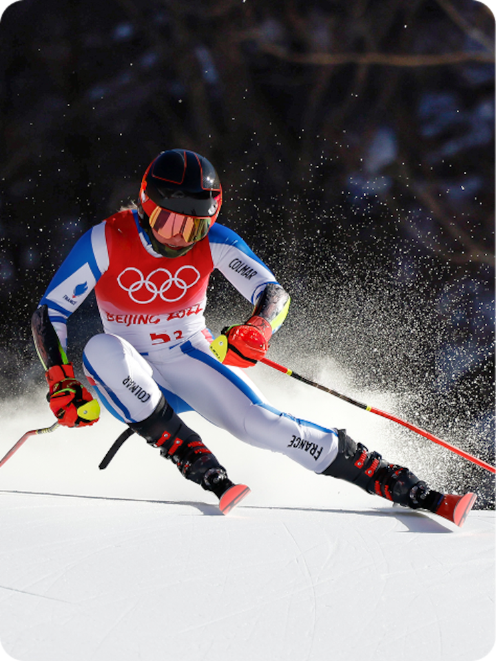 French alpine skier Tessa Worley races down a snowy mountain during the Beijing Olympics