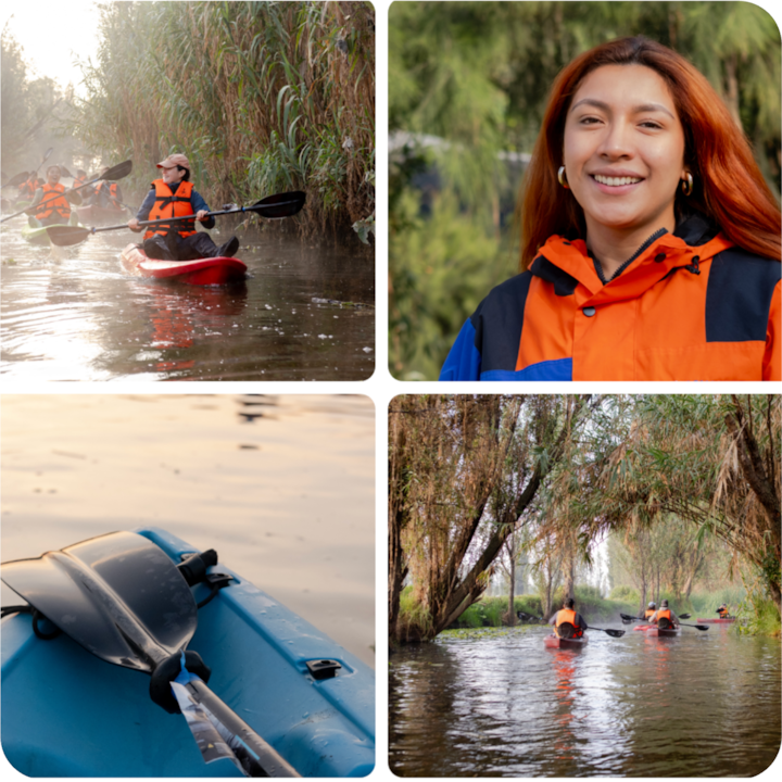Plan rapproché d'un kayak bleu avec une pagaie posée dessus, flottant sur des eaux calmes au coucher du soleil.