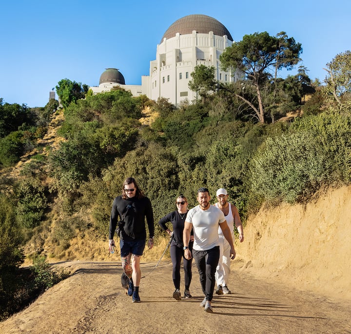 An image of four people hiking on a sunny day in Griffith Park