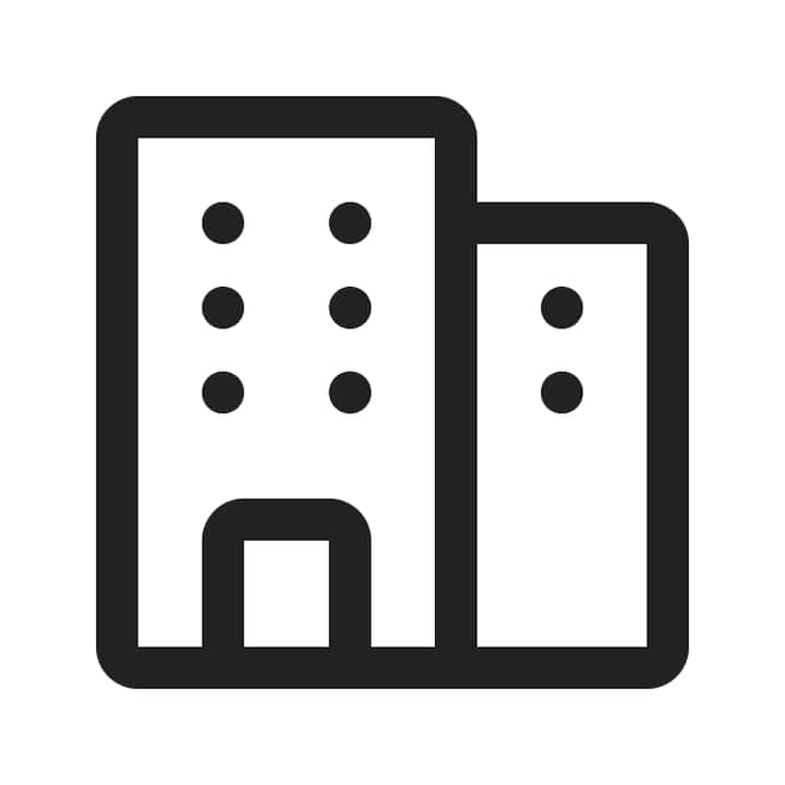 Dessin minimaliste de deux bâtiments avec de petites fenêtres rondes et une porte, représentant des logements standard pour la section des guides sur les outils.