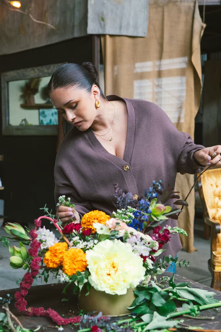 someone making a flower arrangement