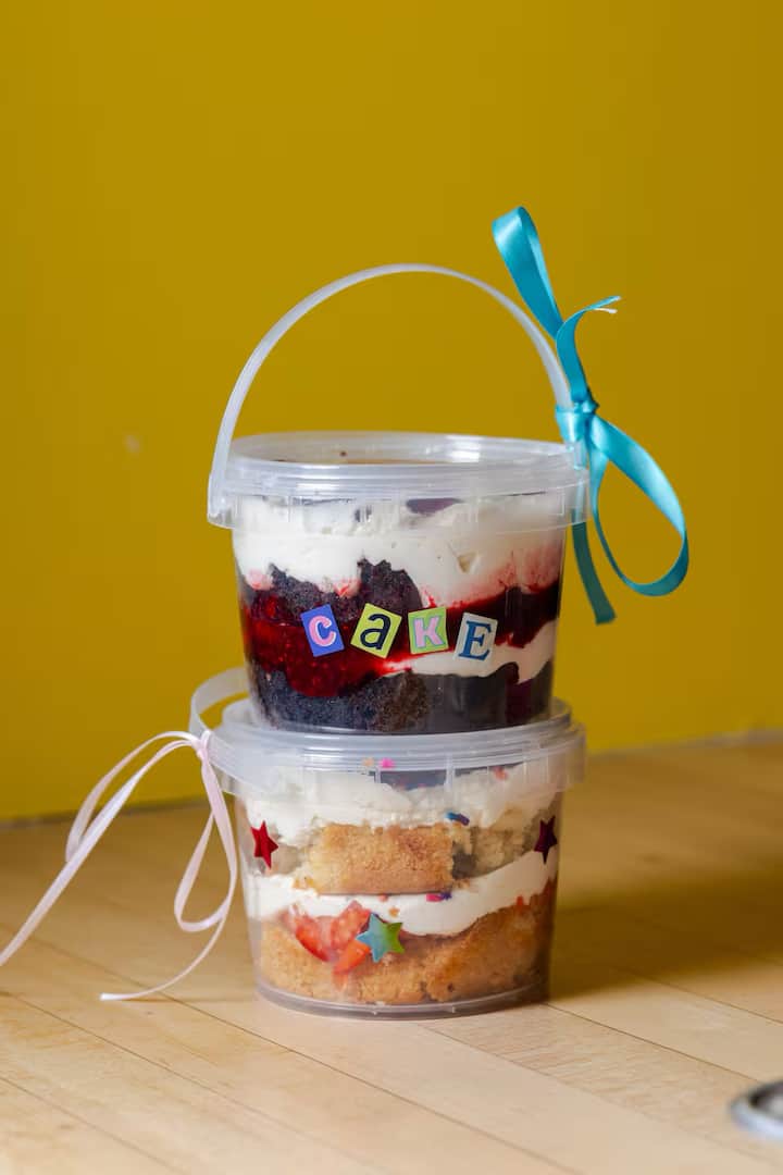 Colorful cake parfaits in clear to-go buckets at Grand Central Market in Downtown Los Angeles