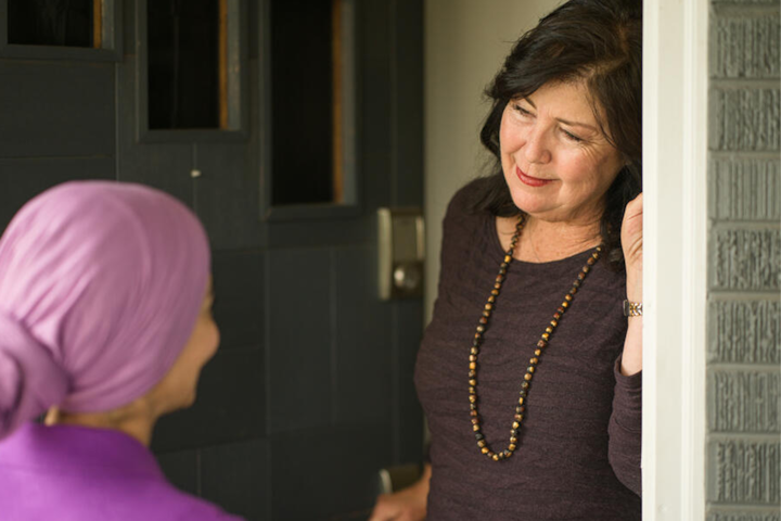 Airbnb host greeting an Airbnb.org guest
