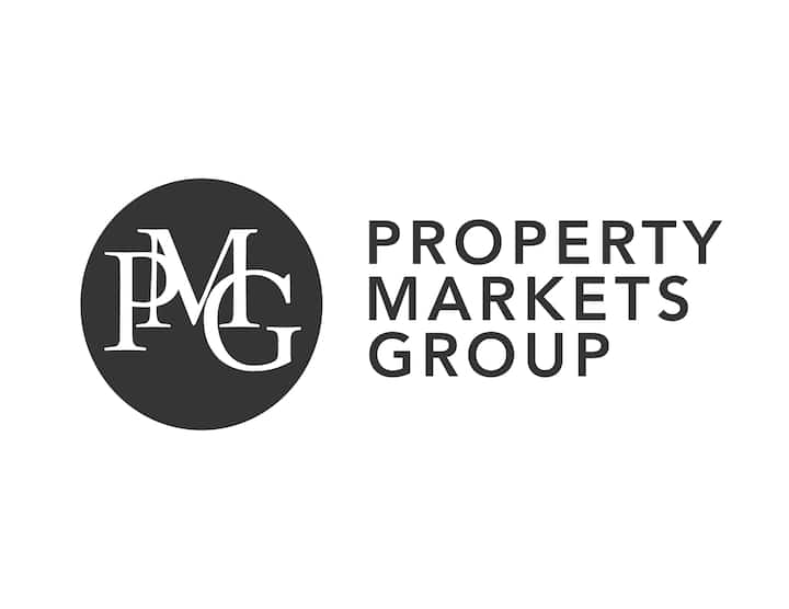 Black and white logo image of Property Markets Group, a member of the Airbnb-friendly program