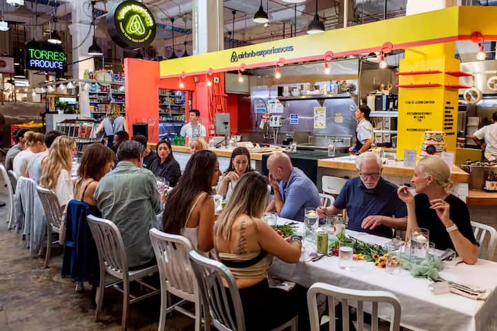People dining at a long table in Grand Central Market