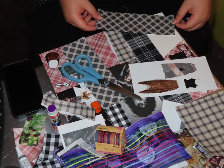 Hands arranging craft materials for a collage-making Airbnb Experience at Grand Central Market in Downtown LA