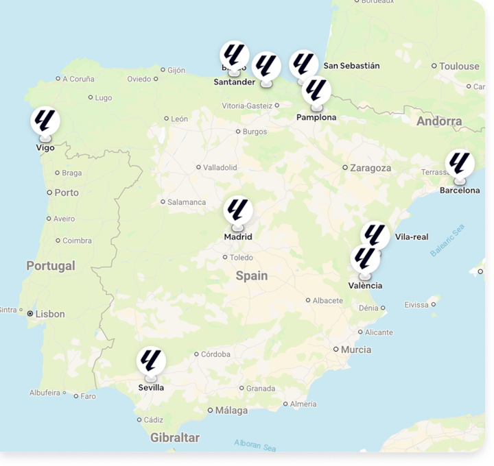 Map of Spain with LALIGA logo pins marking stadium locations across the country.