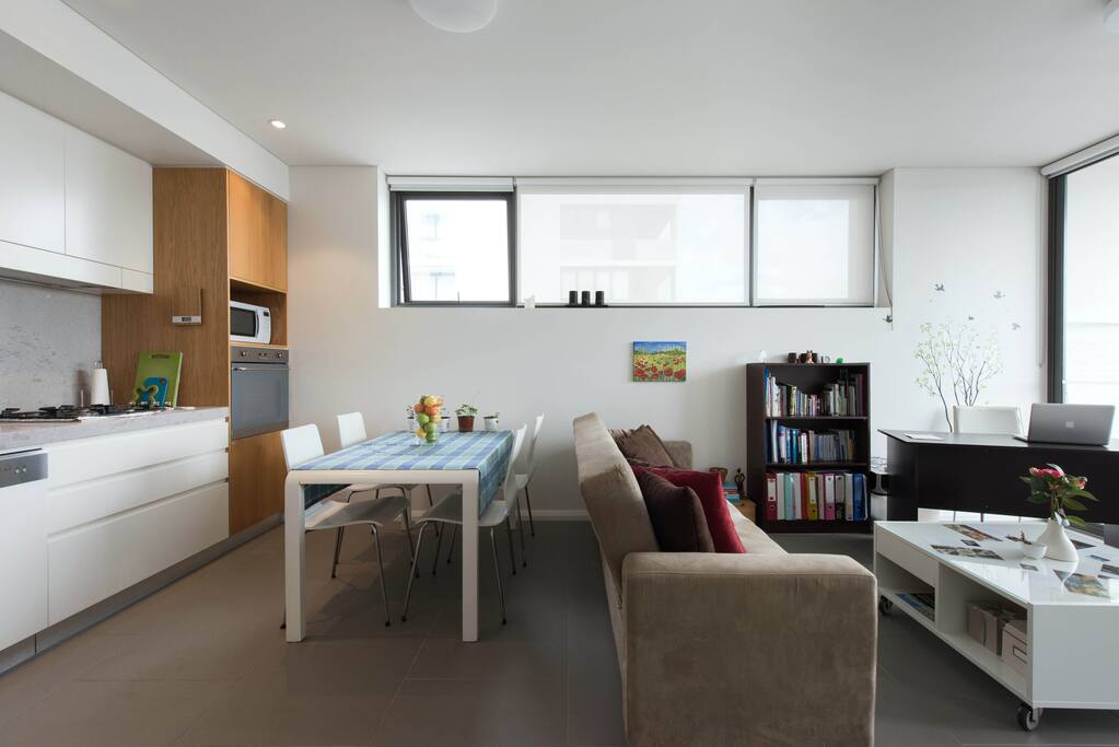The open layout designed. Sofa is now against the wall.