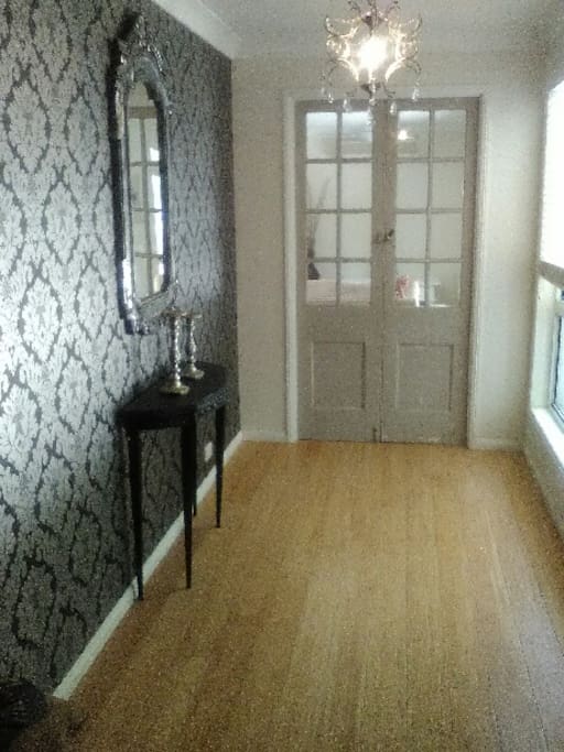 Front entrance french door that provide privacy to the main bedroom.