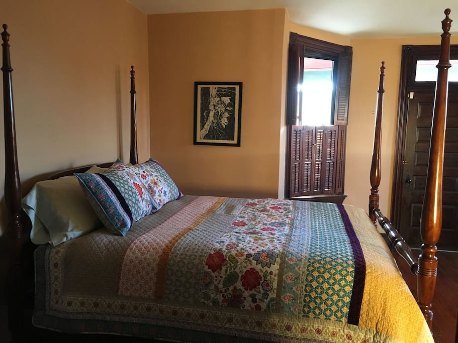 Queen sized bed in sunny west-facing room