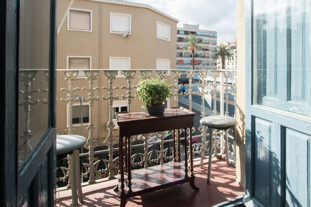 In your room, French doors with traditional wooden shutters open up to a small terrace, where you can sit and people-watch.