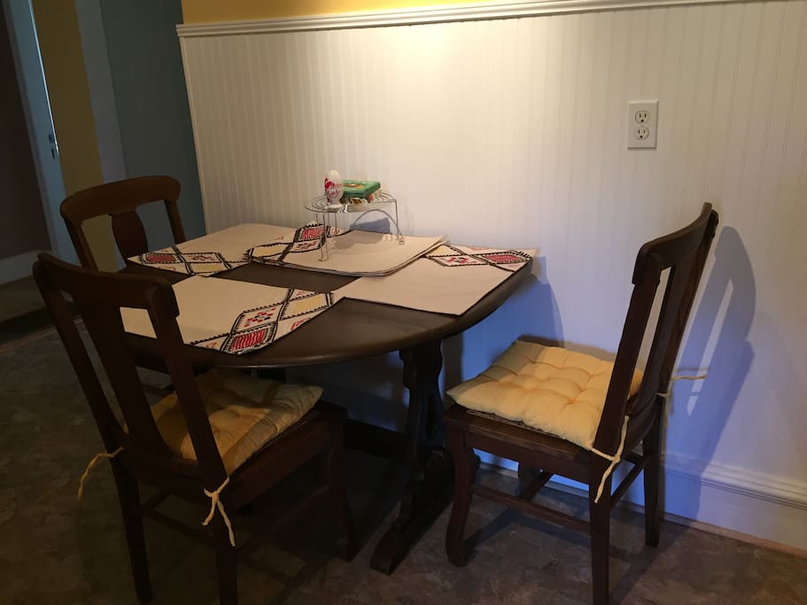 Table can be pulled out and extended for more seating.