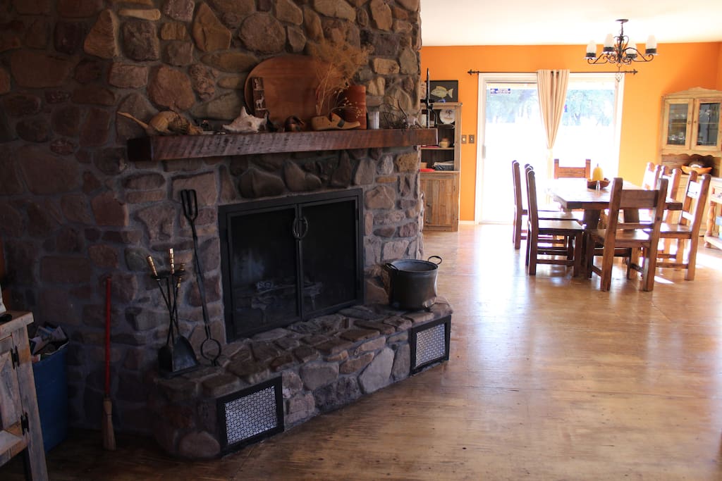Stone fireplace keeps chilly evenings toasty. Who wants to make s'mores?