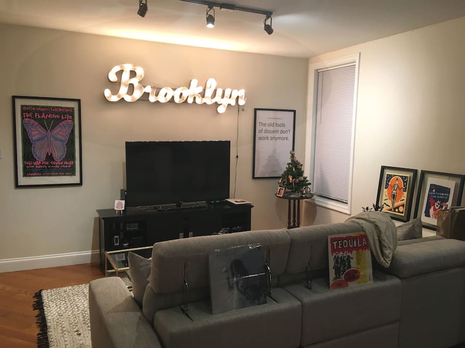 Living room TV with Netflix and HBOGo. "Brooklyn" marquee light in case you forget which borough you're in.