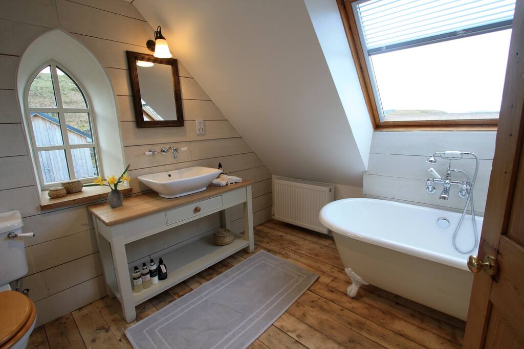 Bath and shower room 2 (separate shower cubicle behind door) with view across Kilmartin Glen