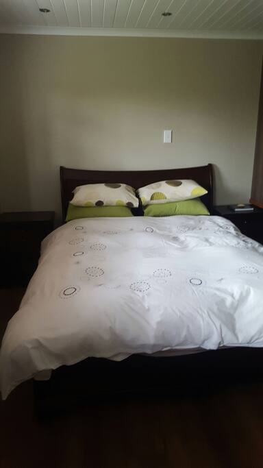 Bedroom with Queen size extra length bed.
