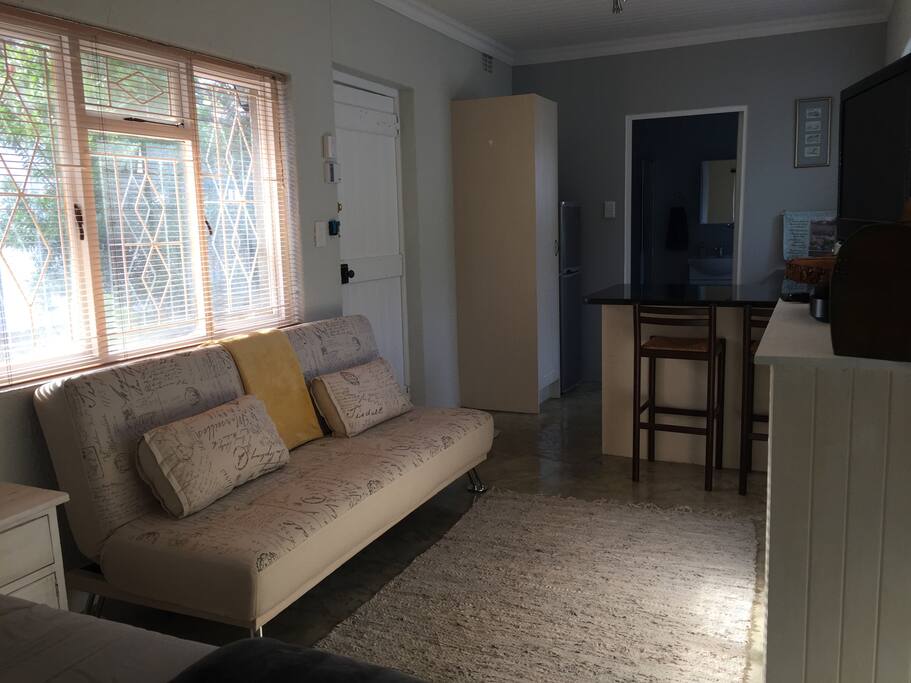 Sitting area with a sleeper couch and HD television with Dstv