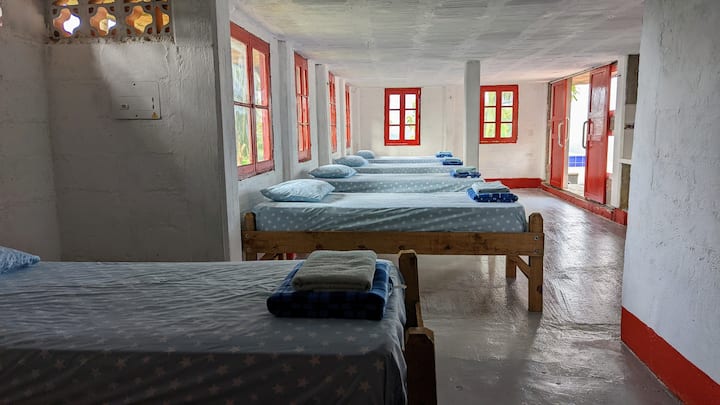 Dorm room with 7 single beds + en-suite – great for groups