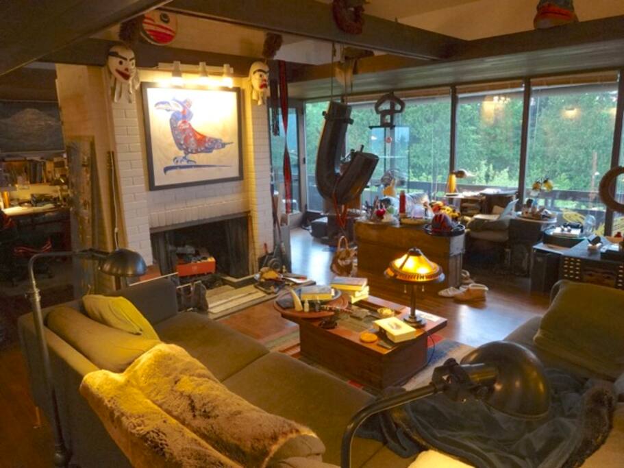 Fireplace, more art and view window over forest and Puget Sound.
