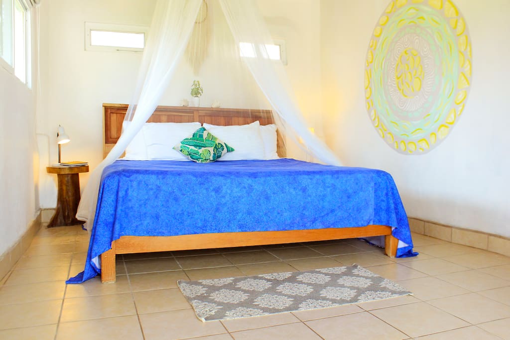 Beautiful natural light filled penthouse room with Caribbean sea view.