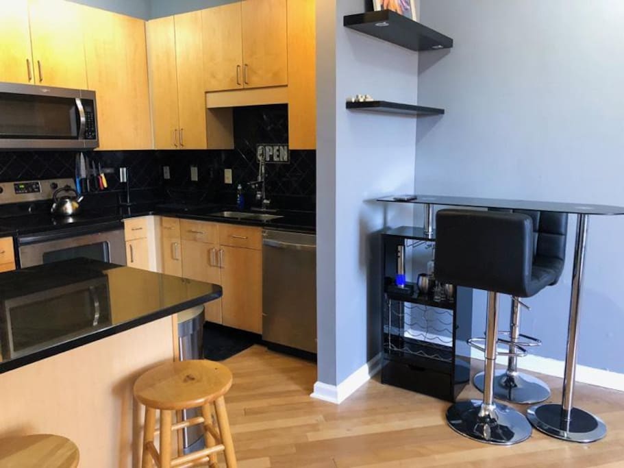 Bar area with glasses and electric wine-opener.
