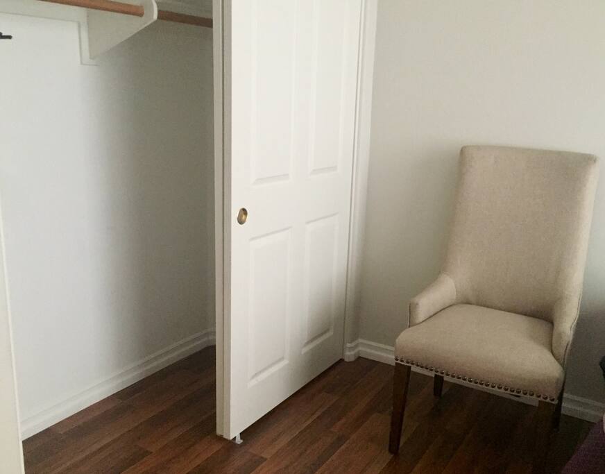Big closet and chair.