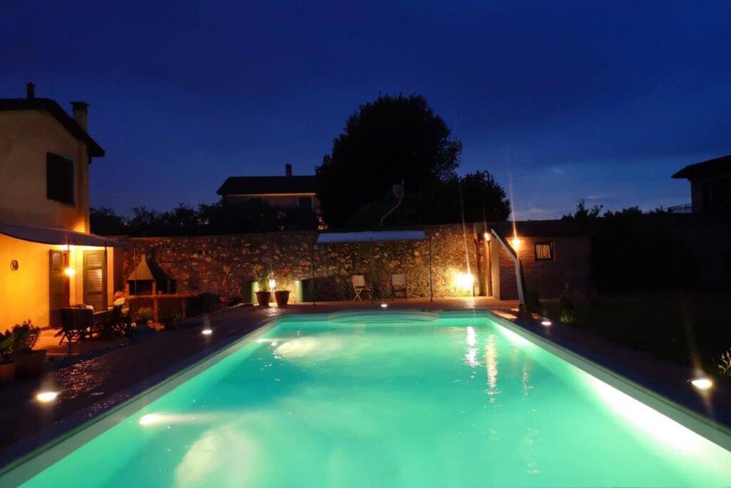 Exterior with dining area and pool