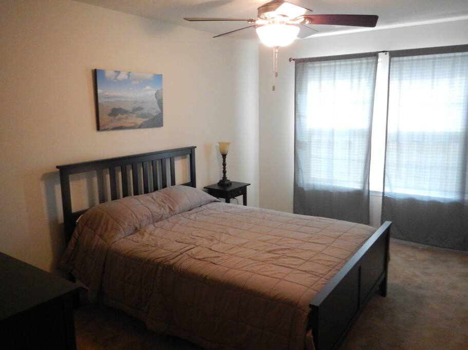 Queen Bed with Ceiling Fan and overhead light
