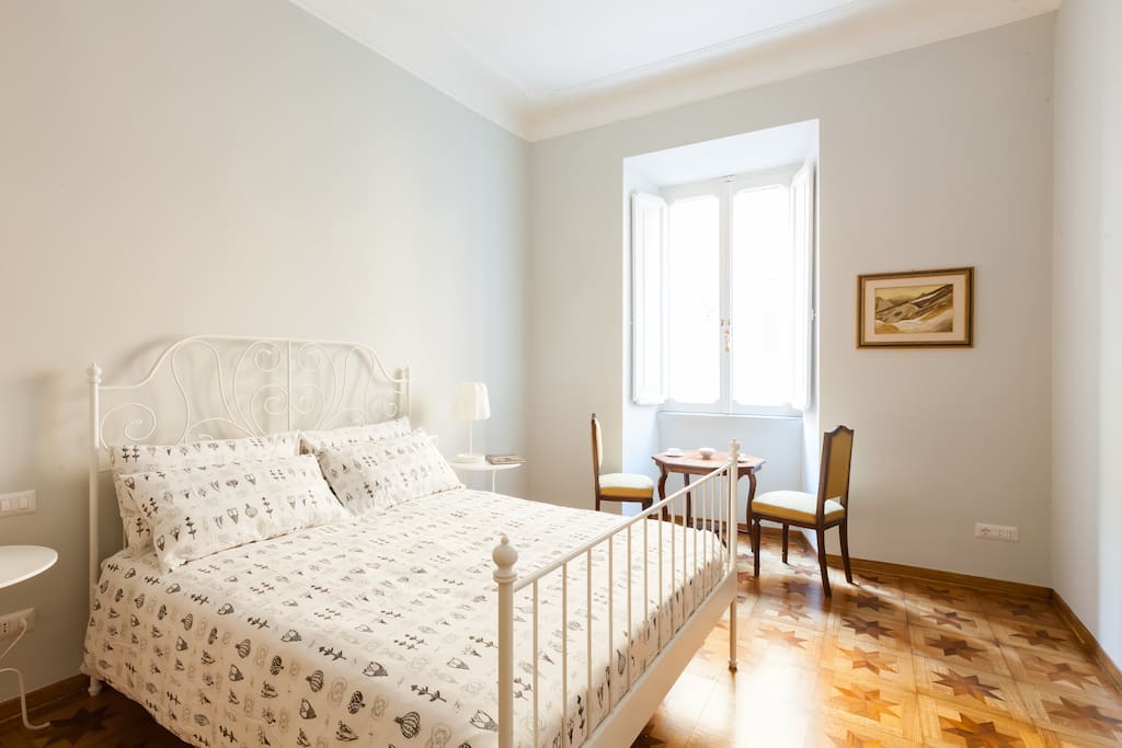 Masterbedroom being a 20 sq.mt with a queen bed (63" x 80") and furnished with antiques which include an armoire.