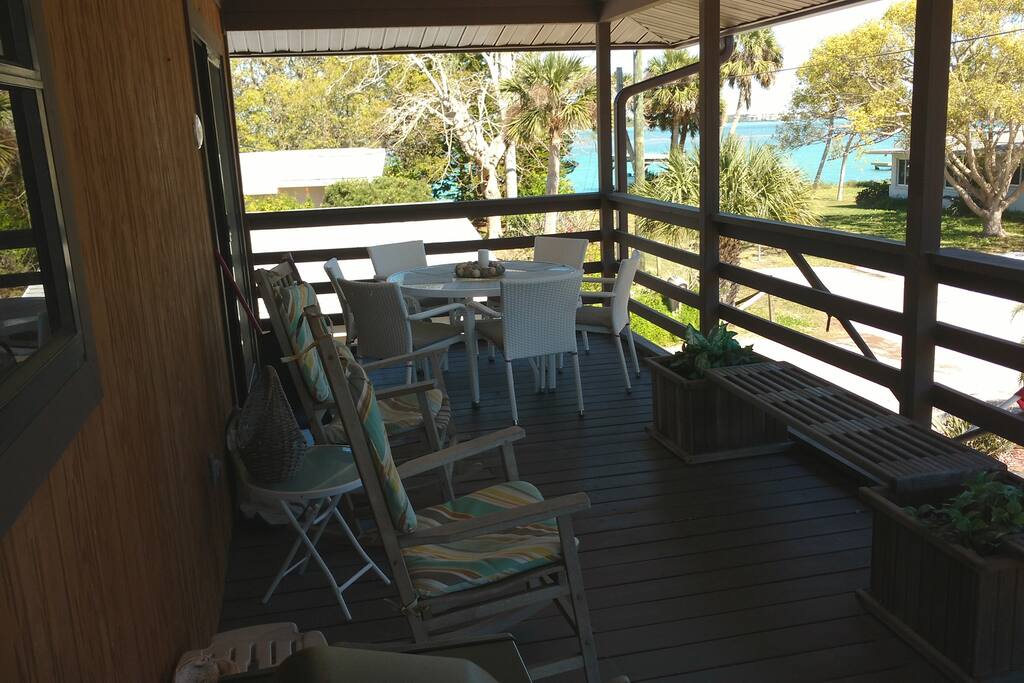 Deck looking towards bay with new outdoor table and chairs that seat 6.
