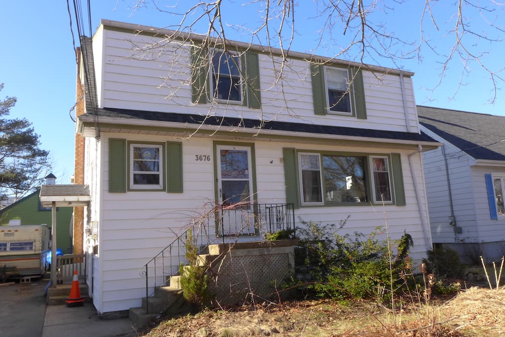 Here' our big ol' house, early spring when the gardens are still mulched.
